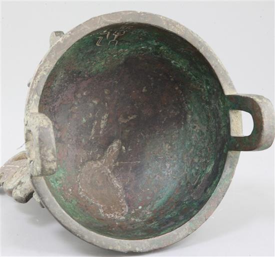 A Chinese archaic bronze tripod ritual food vessel, late Shang/early Western Zhou dynasty, 23cm high, repairs